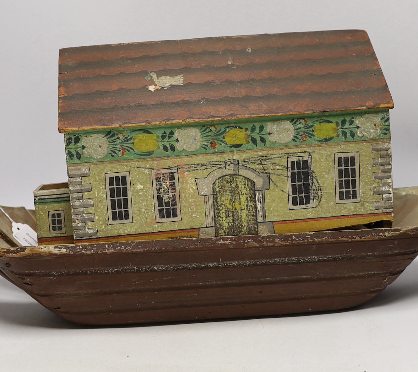 A mid 19th century Swiss or German Noah's Ark for restoration (incomplete), containing a selection of carved wooden animals, 69cm long, 32cm high